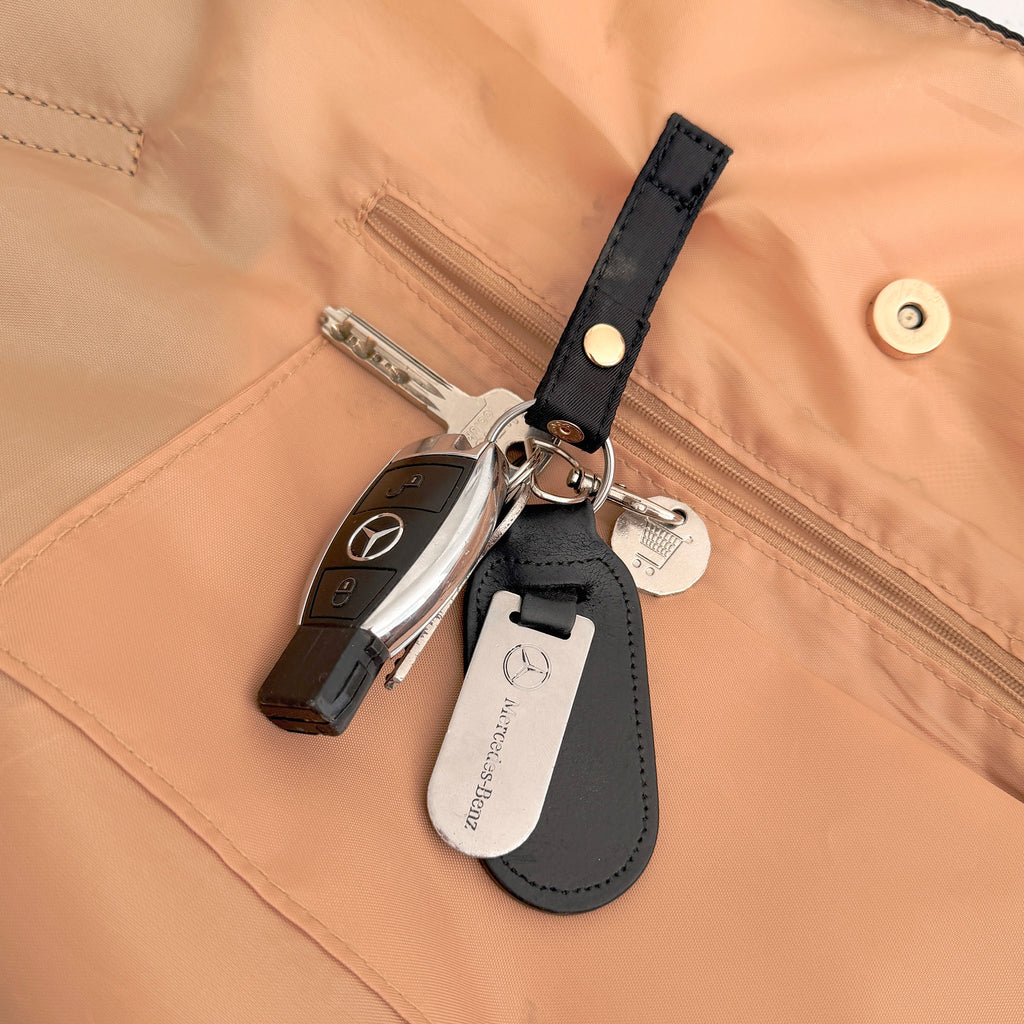 OYSTER lay-flat tote with internal key snap tab keeping keys secure and easy to find.