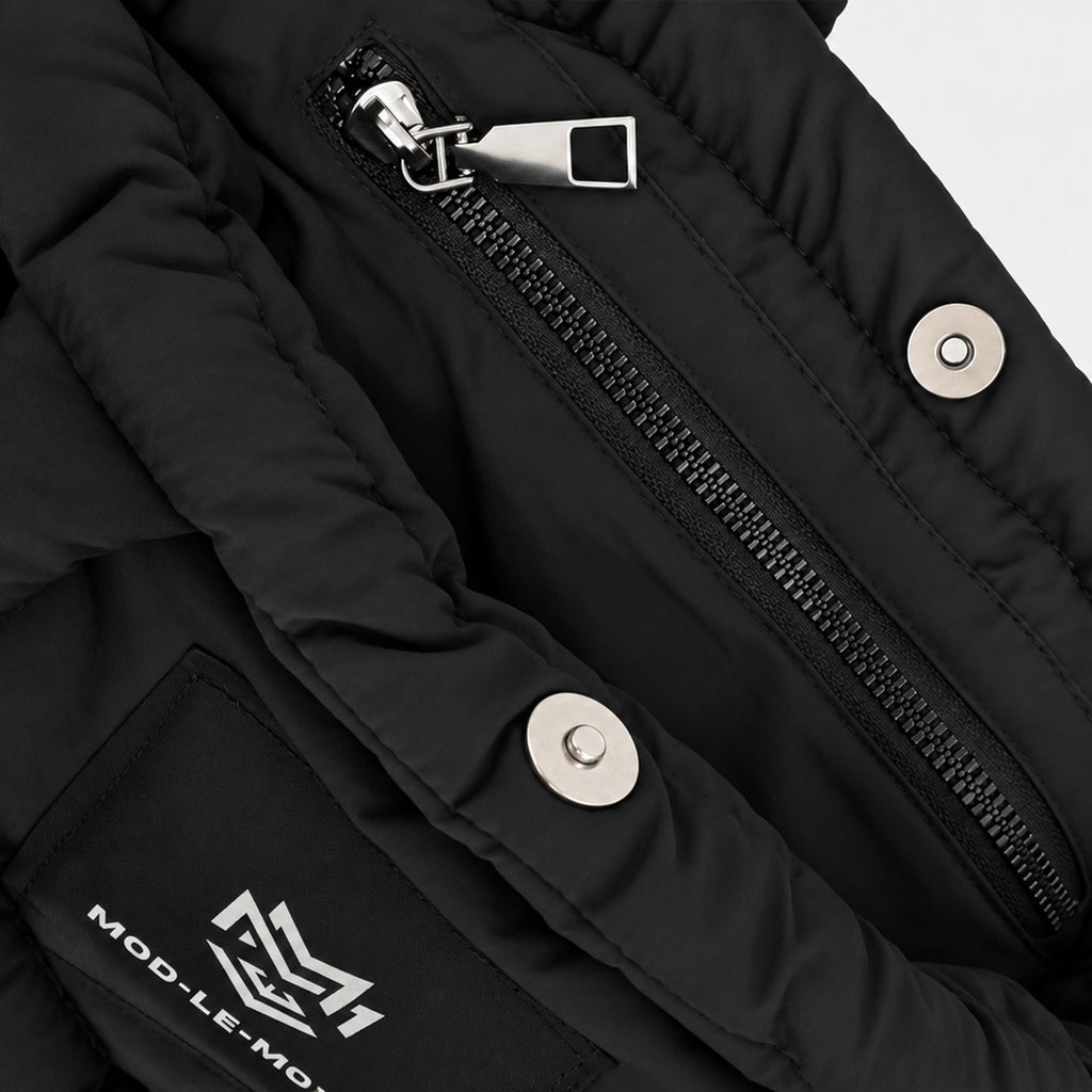 Close-up of the internal zip pocket inside the black MOD-LE-MODE PUFFER Mini tote bag, providing secure storage for everyday essentials.